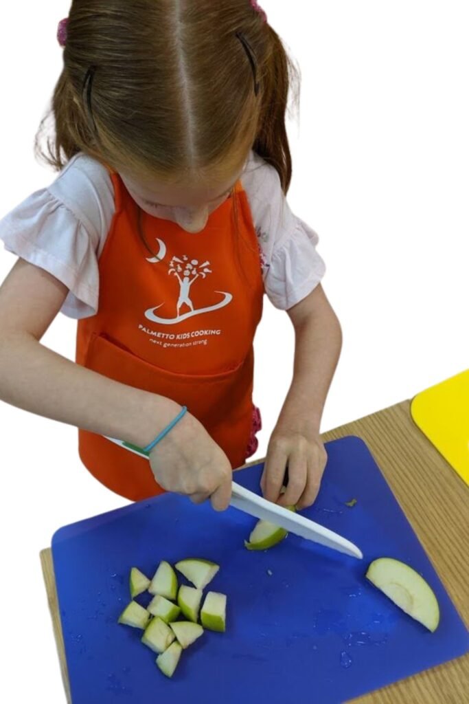 Child safe knife. Child learning proper knife skills