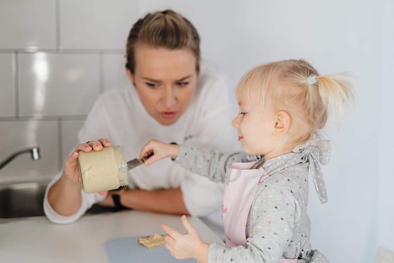 A mother and daughter bonding over baking, enjoying time in the kitchen.