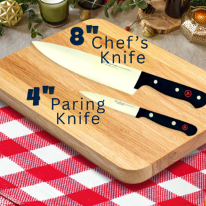 A set of Wusthof knives. 8" chef's knife and 4" paring on a cutting board and red and white checkered table cloth.